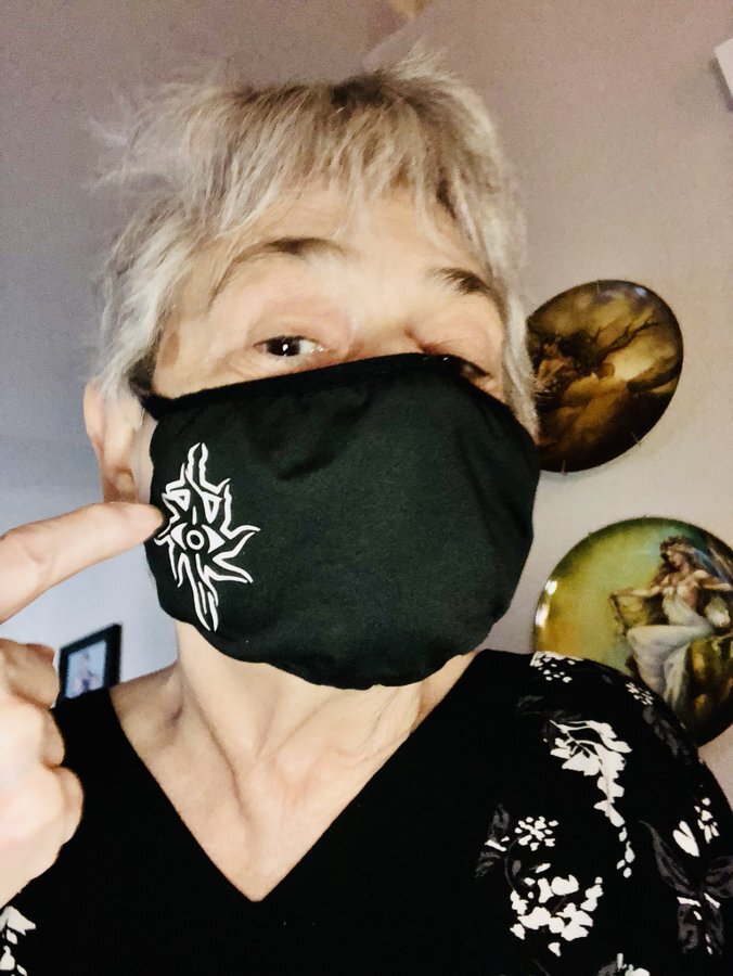 Gamin' Granny wearing her face mask with the Seekers logo from Dragon Age: Inquisition.