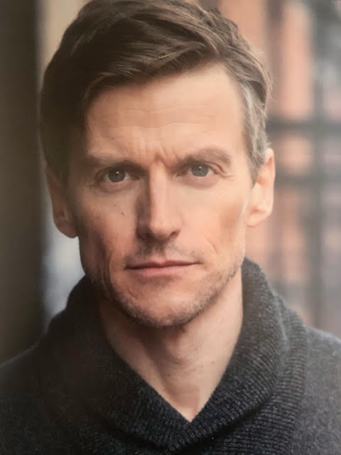 Gideon Emery headshot photo.